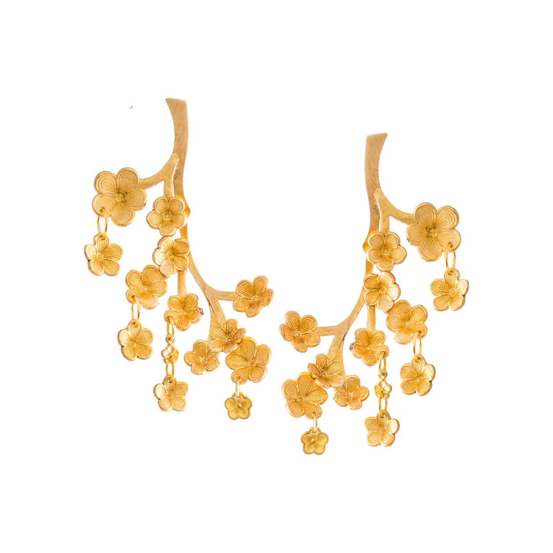 Front view of Sekiba earrings showcasing cascading hand-shaped brass cherry-blossom petals with dangling flowers on white background