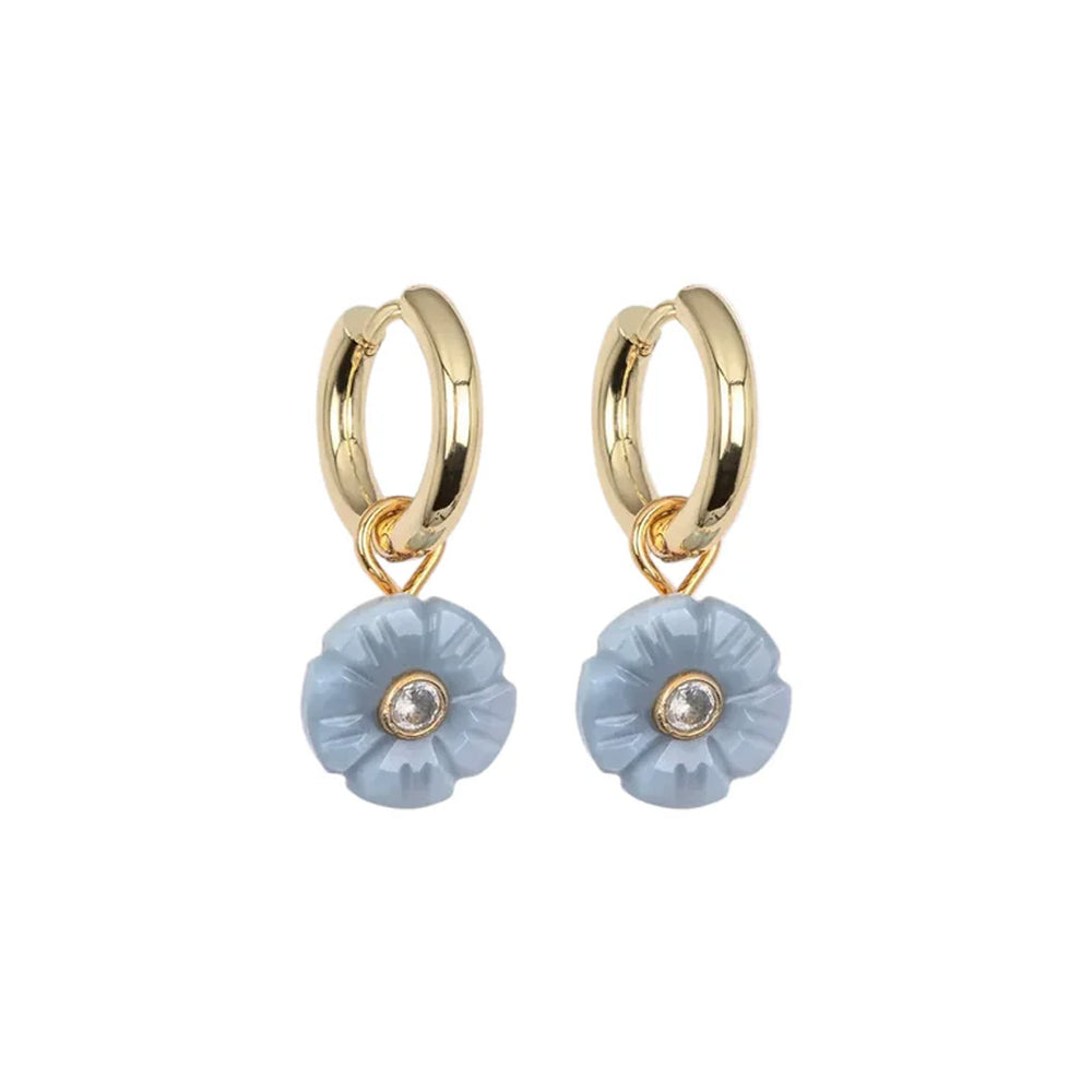 Front view of Lillian earrings with gold-plated huggies and blue opal flower charms with crystal centers on white background