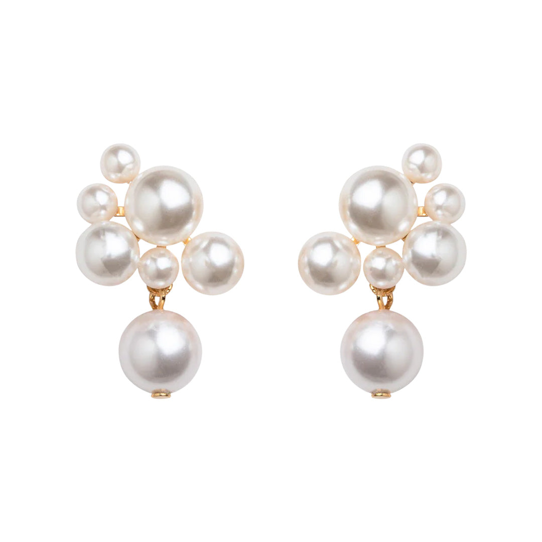 Front view of Perlita Earrings in Pearl showcasing clustered crystal pearls and hinged pearl drops with a white background