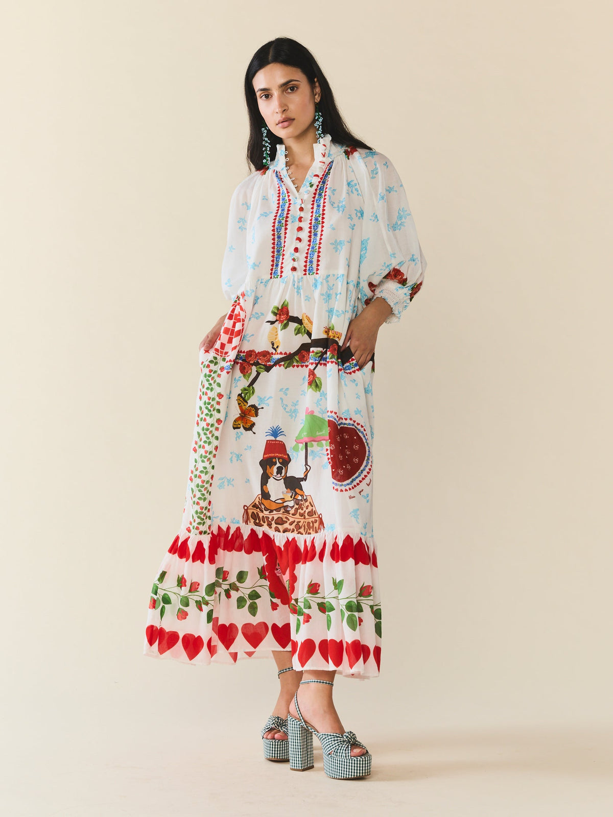 Front view of Eliza Dress in Alfie White with easy fit, floral and butterfly motifs, smocked neckline, and elbow sleeves