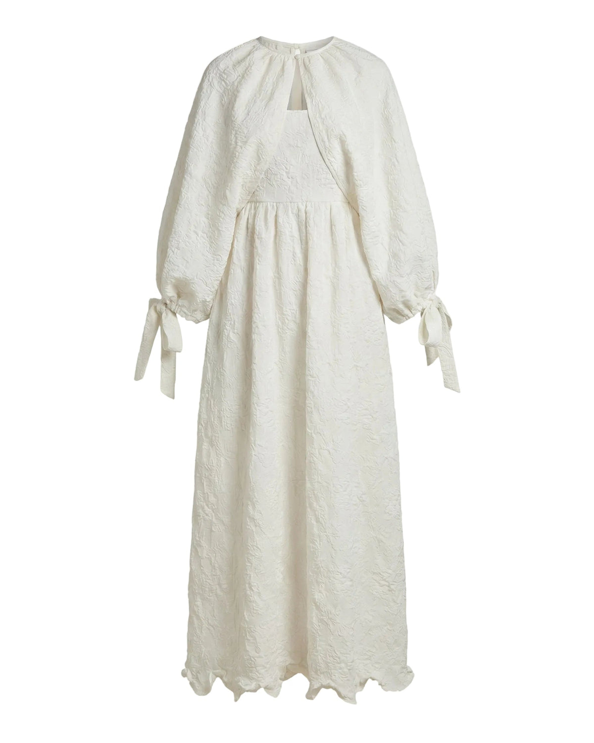 Front view of Mary Cape in Chapel White Floral showcasing balloon sleeves with tie cuffs on white background