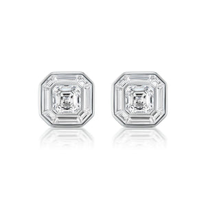 The Mosaic Studs feature central Asscher cut diamonds surrounded by baguette diamonds in a striking octagonal pattern, all set in 18k white gold.