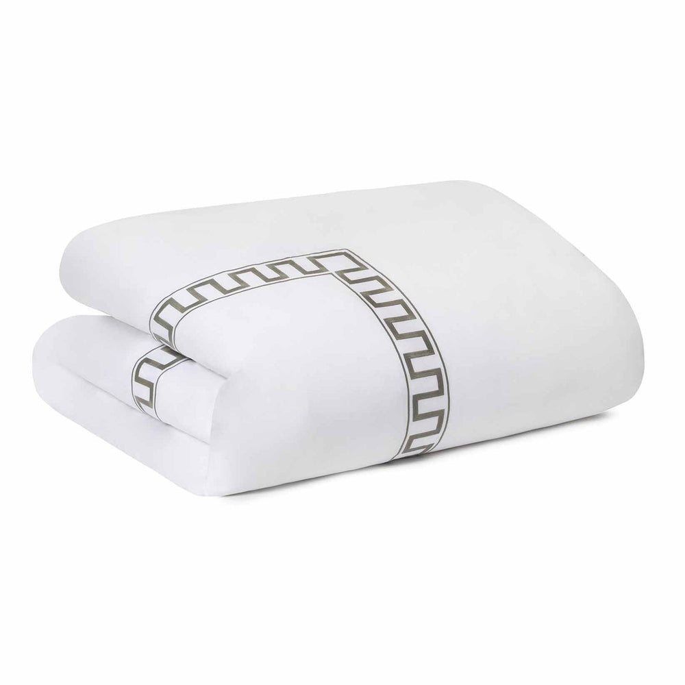 Folded front view of Greek Key duvet in sage showing embroidered Greek key border on white background