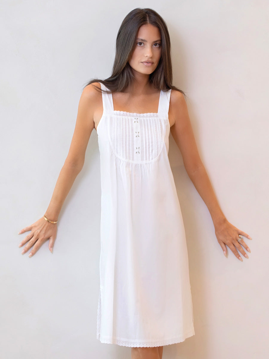 Front view of Everly white cotton nightgown with square neckline, strap sleeves, eyelet lace and rosebud embroidery