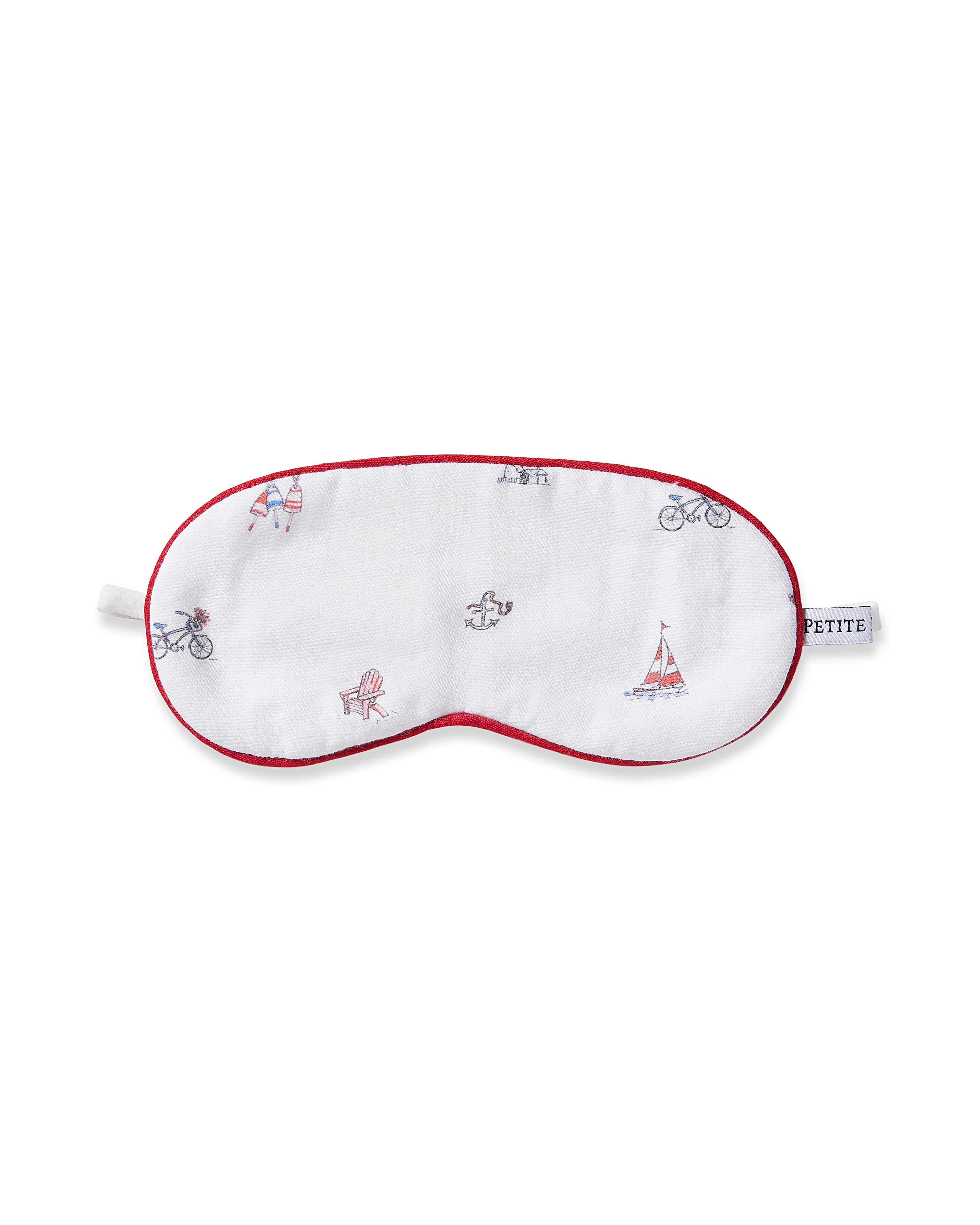 The Kids Coastal Charms Eye Mask by Petite Plume is a white sleep mask with red trim, adorned with illustrations of a bicycle, sailboat, folding chair, and rower. A PETITE tag on the side makes it perfect for personalization and gifting to those who love custom touches.