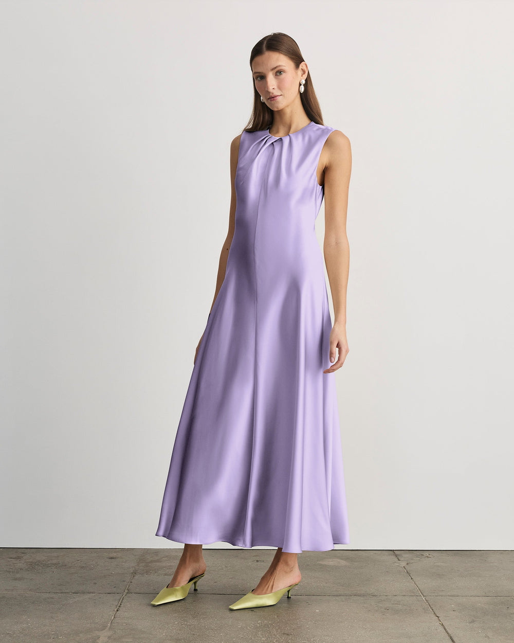 Front view of Emily Dress in lavender on model with pleated crew neck and flowing bias-cut skirt