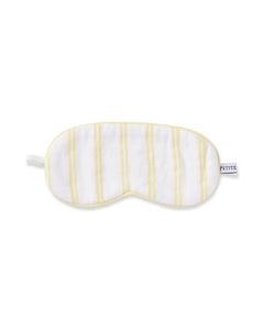 The Kids Twill Sleep Mask in Sunny Stripe by Petite Plume is a white eye mask with sunny stripes and a PETITE side label, offering full coverage for soft, comfortable sleep.