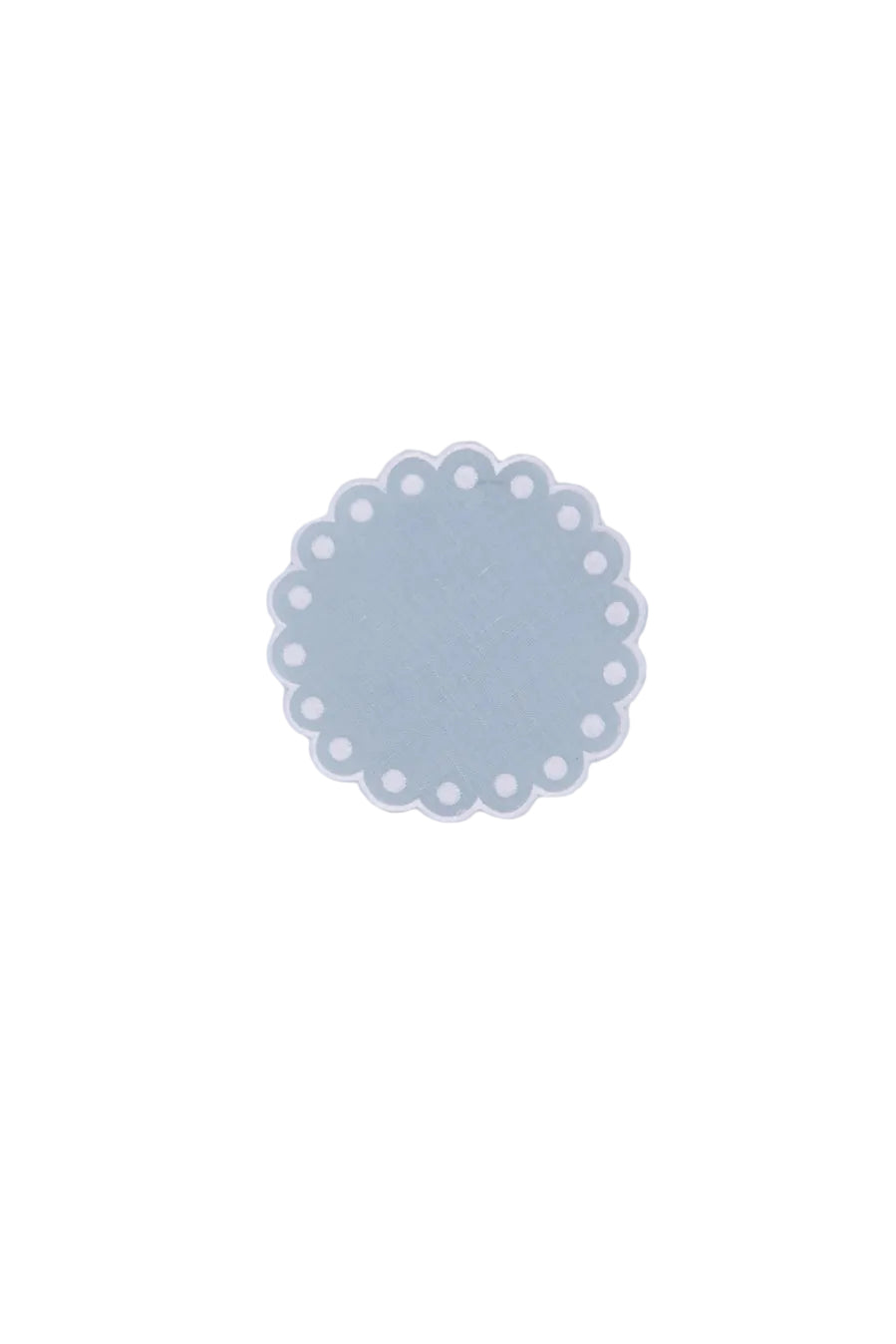 Top view of Bodoques linen coaster in light blue showcasing scalloped embroidered edge and white embroidered dots on a white background