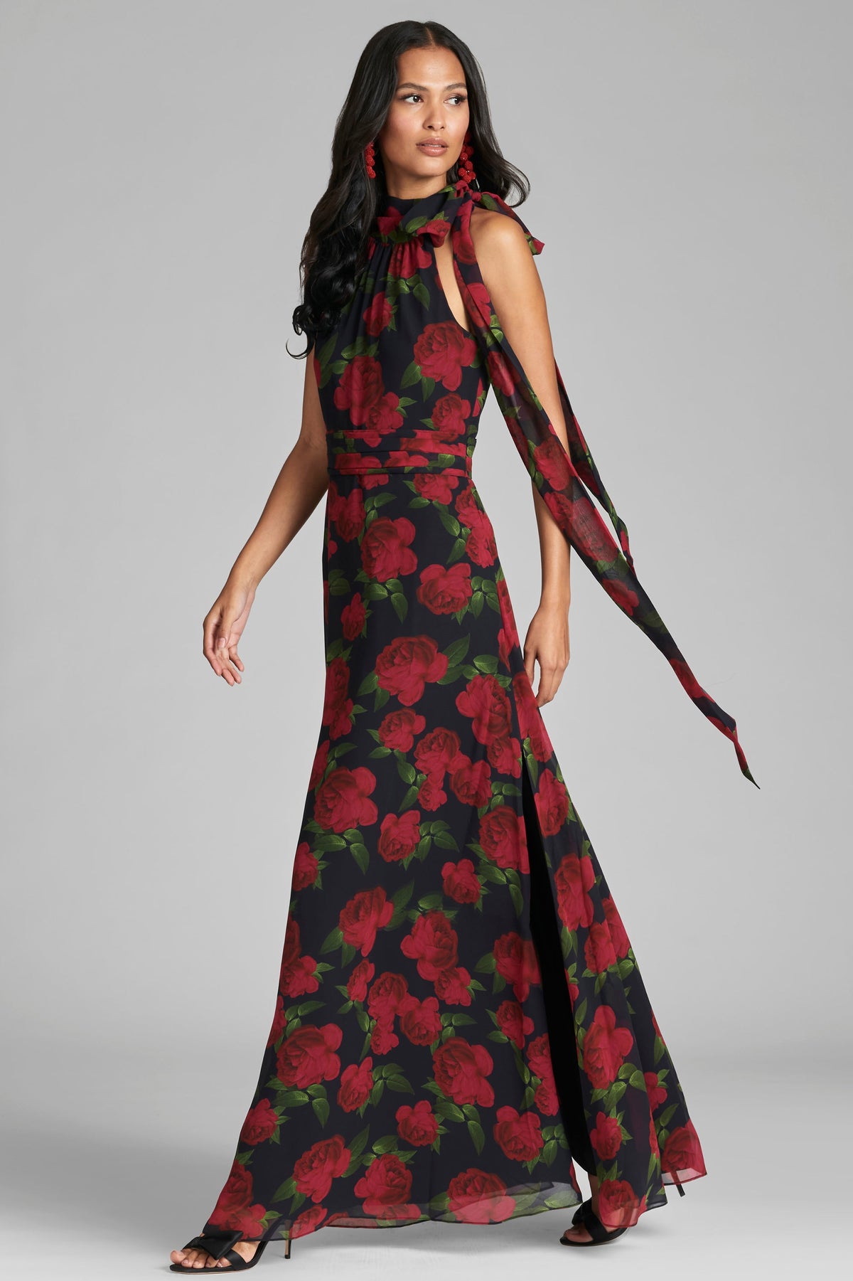 Front view of Kayla Gown in Ruby Tea Roses showcasing self-tie neckline and pleated waistband with gray studio background