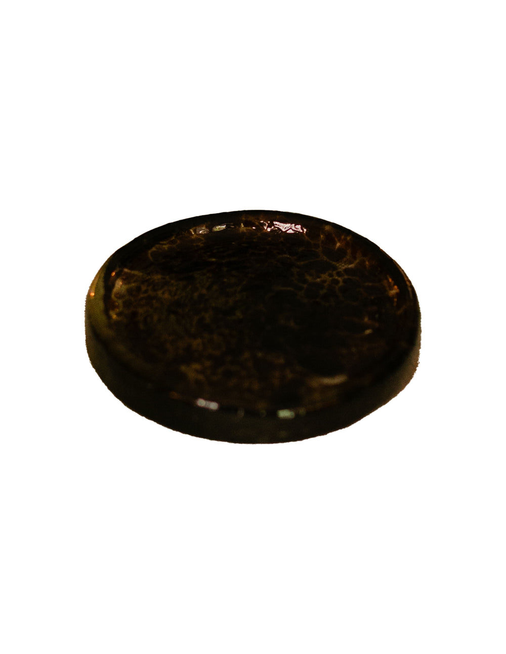 Angled front view of glass trivet in olive showcasing marbled glossy finish on white background