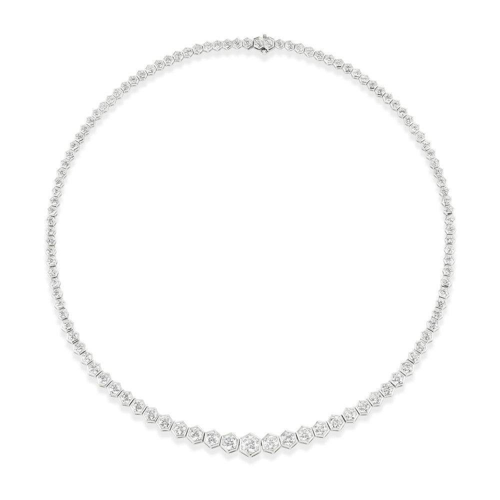 The Graduated Hexagon Bezel Set Round Diamond Tennis Necklace in White Gold features round diamonds set in hexagon bezels along a delicate 18k chain, forming an elegant and classic 16-inch necklace.
