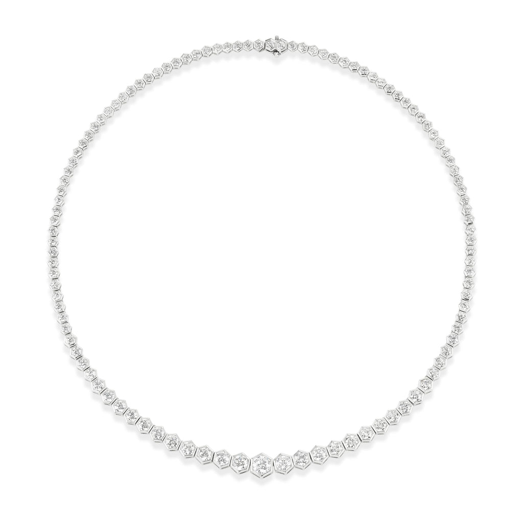 The Graduated Hexagon Bezel Set Round Diamond Tennis Necklace in White Gold features round diamonds set in hexagon bezels along a delicate 18k chain, forming an elegant and classic 16-inch necklace.