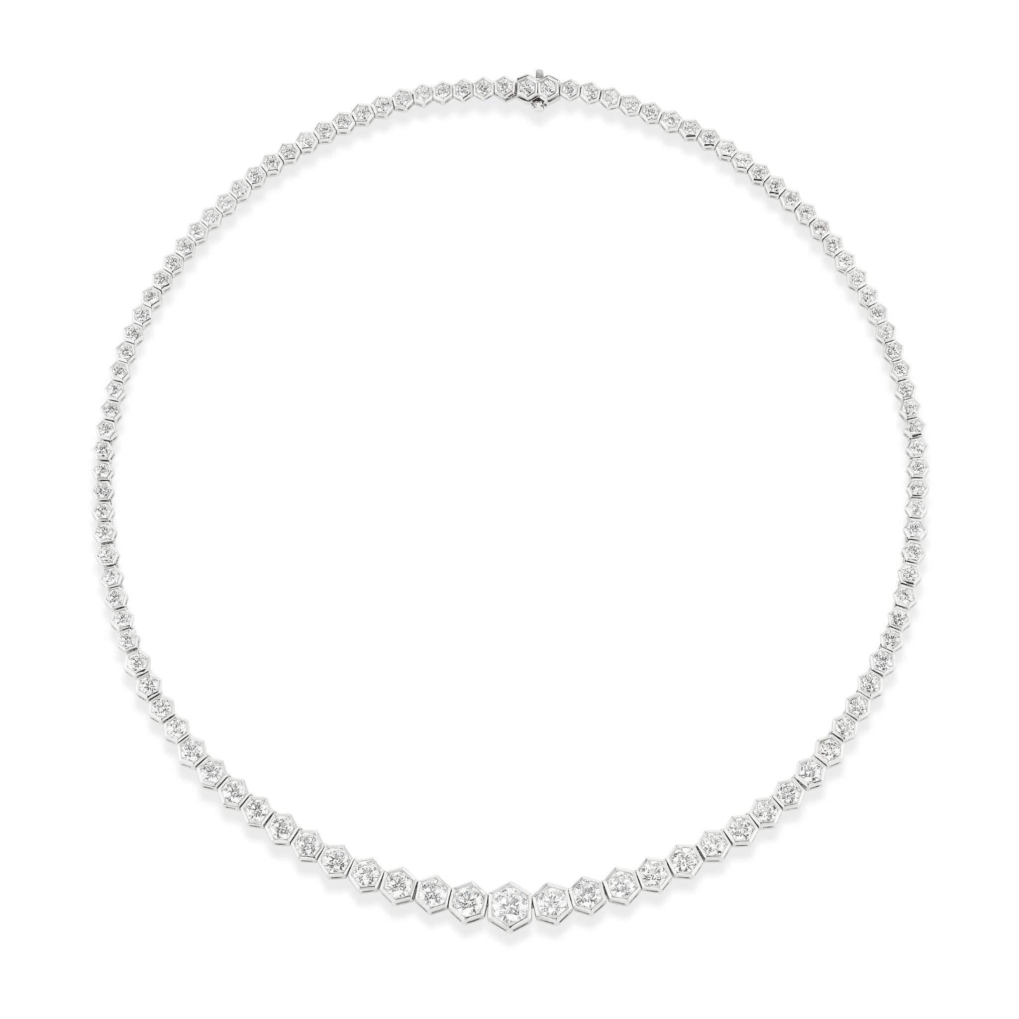 The Graduated Hexagon Bezel Set Round Diamond Tennis Necklace in White Gold features round diamonds set in hexagon bezels along a delicate 18k chain, forming an elegant and classic 16-inch necklace.