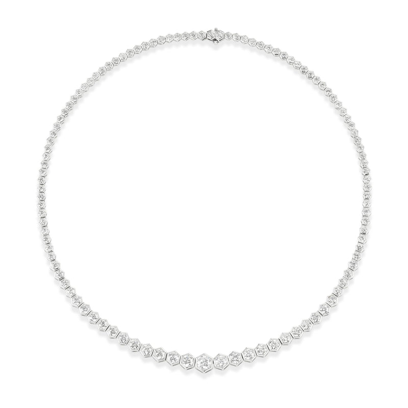 The Graduated Hexagon Bezel Set Round Diamond Tennis Necklace in White Gold features round diamonds set in hexagon bezels along a delicate 18k chain, forming an elegant and classic 16-inch necklace.