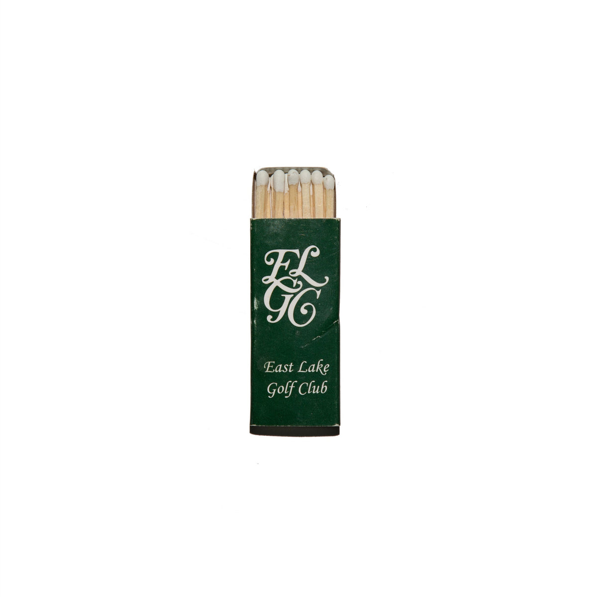 Front view of East Lake Golf Club matchbook showing green cover with white ELGC monogram and exposed wooden matches on white background