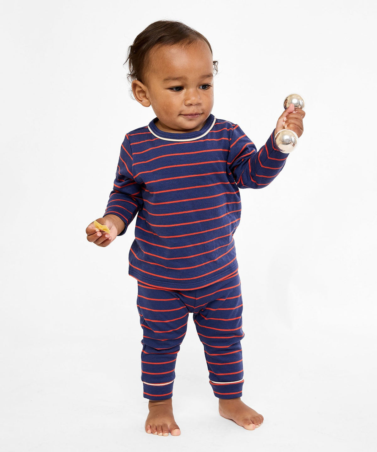 Front view of Edward Baby T-Shirt in Navy Fine Stripe with long sleeves and contrast piping on a baby, white background