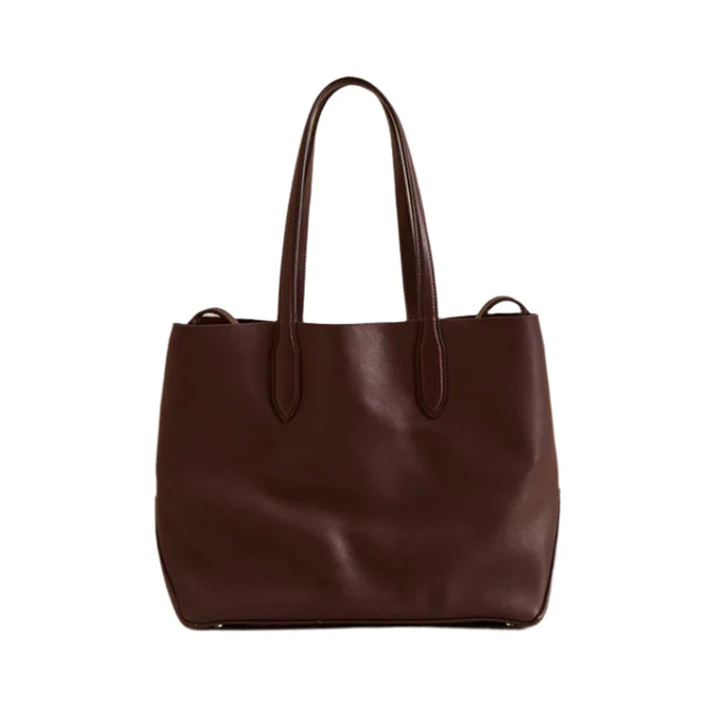 Front view of Eleanor 30 tote showcasing supple soft chocolate leather and double top handles on white background