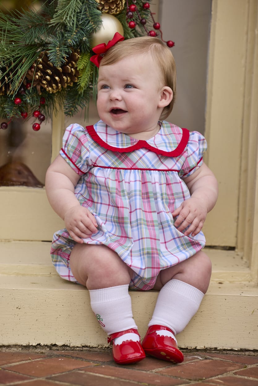 Little English traditional children's clothing.  Puff sleeve and ruffled peter pan collar bubble in red, blue, green, yellow, and white Douglas Plaid with red piping for baby girls for Christmas