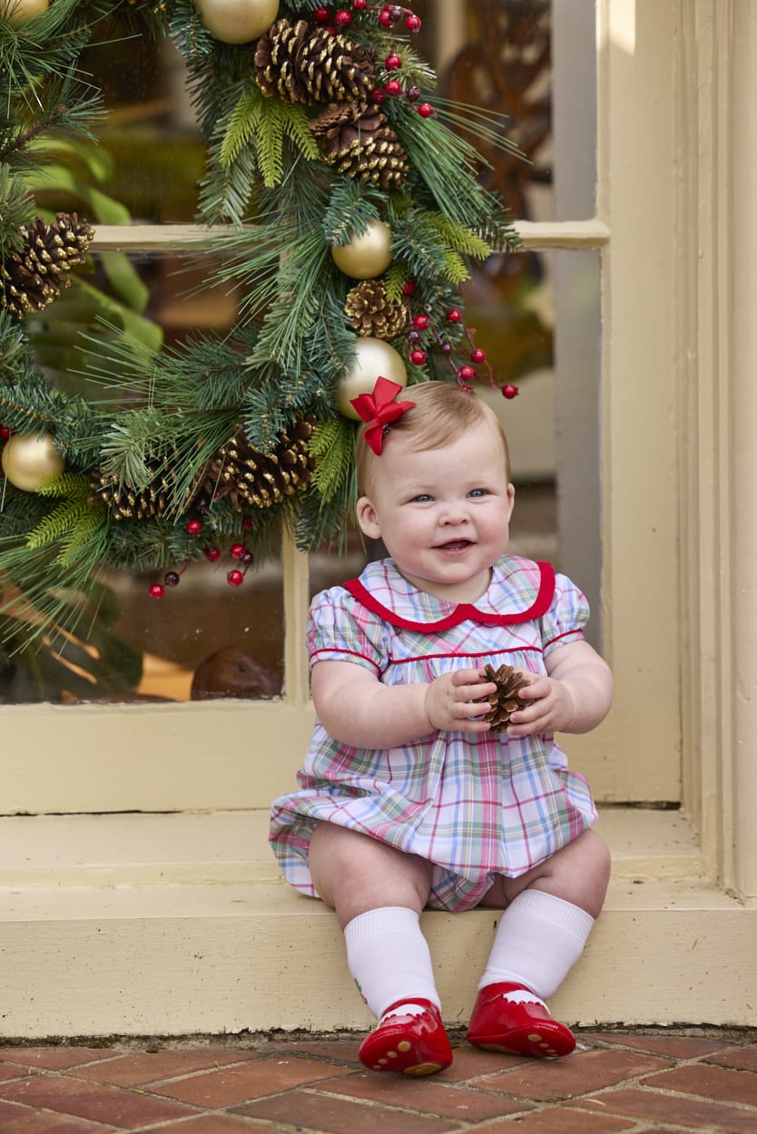 Little English traditional children's clothing.  Puff sleeve and ruffled peter pan collar bubble in red, blue, green, yellow, and white Douglas Plaid with red piping for baby girls for Christmas