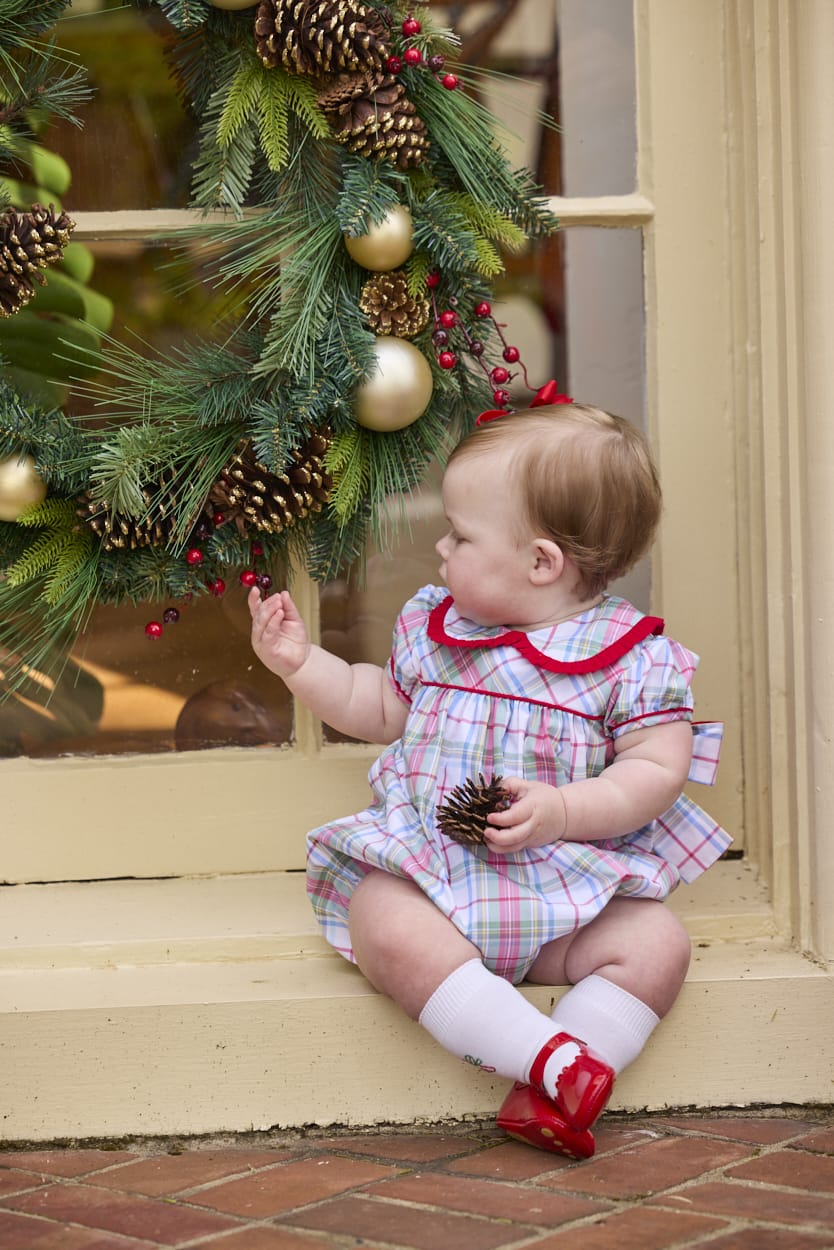 Little English traditional children's clothing.  Puff sleeve and ruffled peter pan collar bubble in red, blue, green, yellow, and white Douglas Plaid with red piping for baby girls for Christmas