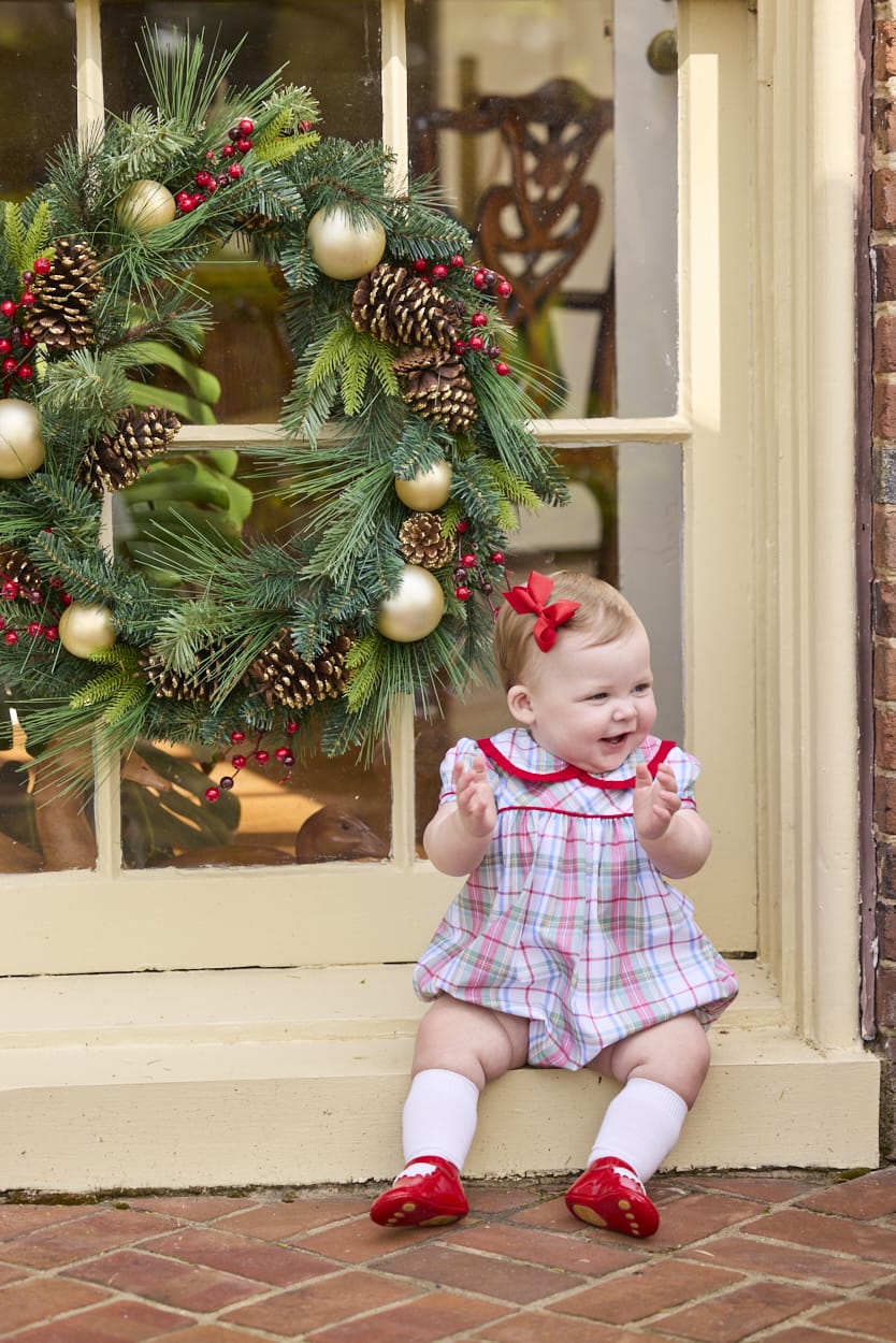 Little English traditional children's clothing.  Puff sleeve and ruffled peter pan collar bubble in red, blue, green, yellow, and white Douglas Plaid with red piping for baby girls for Christmas