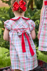 Little English classic children's clothing. Toddler girls puff sleeve dress in red and green plaid with ruffled peter pan collar and bow tie sash in back.