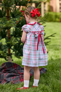 Little English classic children's clothing. Toddler girls puff sleeve dress in red and green plaid with ruffled peter pan collar and bow tie sash in back.