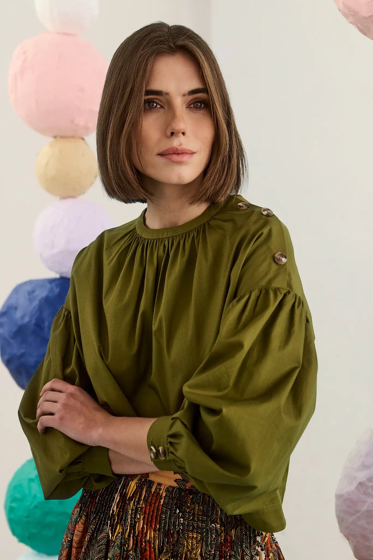 The Eli Top in Pine Grove. Voluminious drop-sleeved top with buttons and crew neckline.