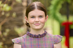 Little English traditional children's clothing. Olive and maroon Thornhill Plaid column dress with capped sleeves, ruffled neckline, and fixed bow in back for older girls for the holidays