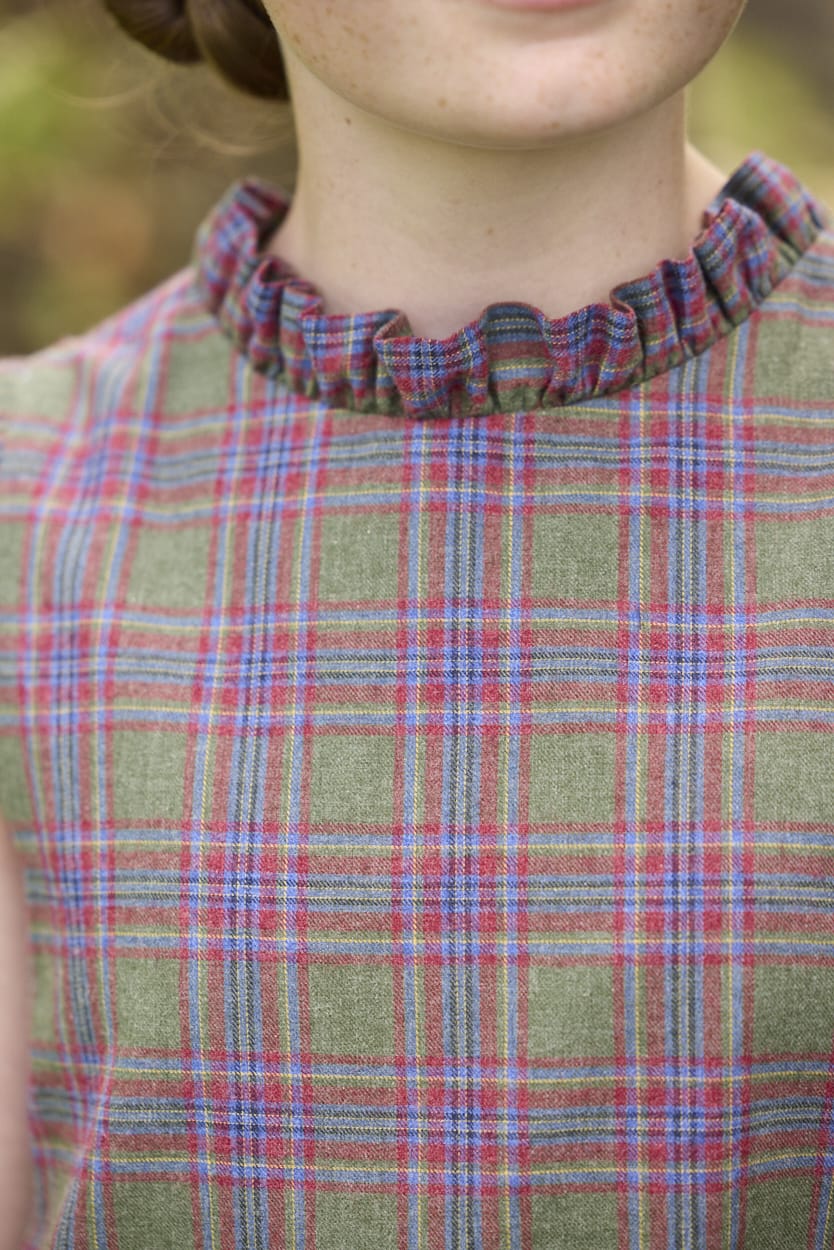 Little English traditional children's clothing. Olive and maroon Thornhill Plaid column dress with capped sleeves, ruffled neckline, and fixed bow in back for older girls for the holidays