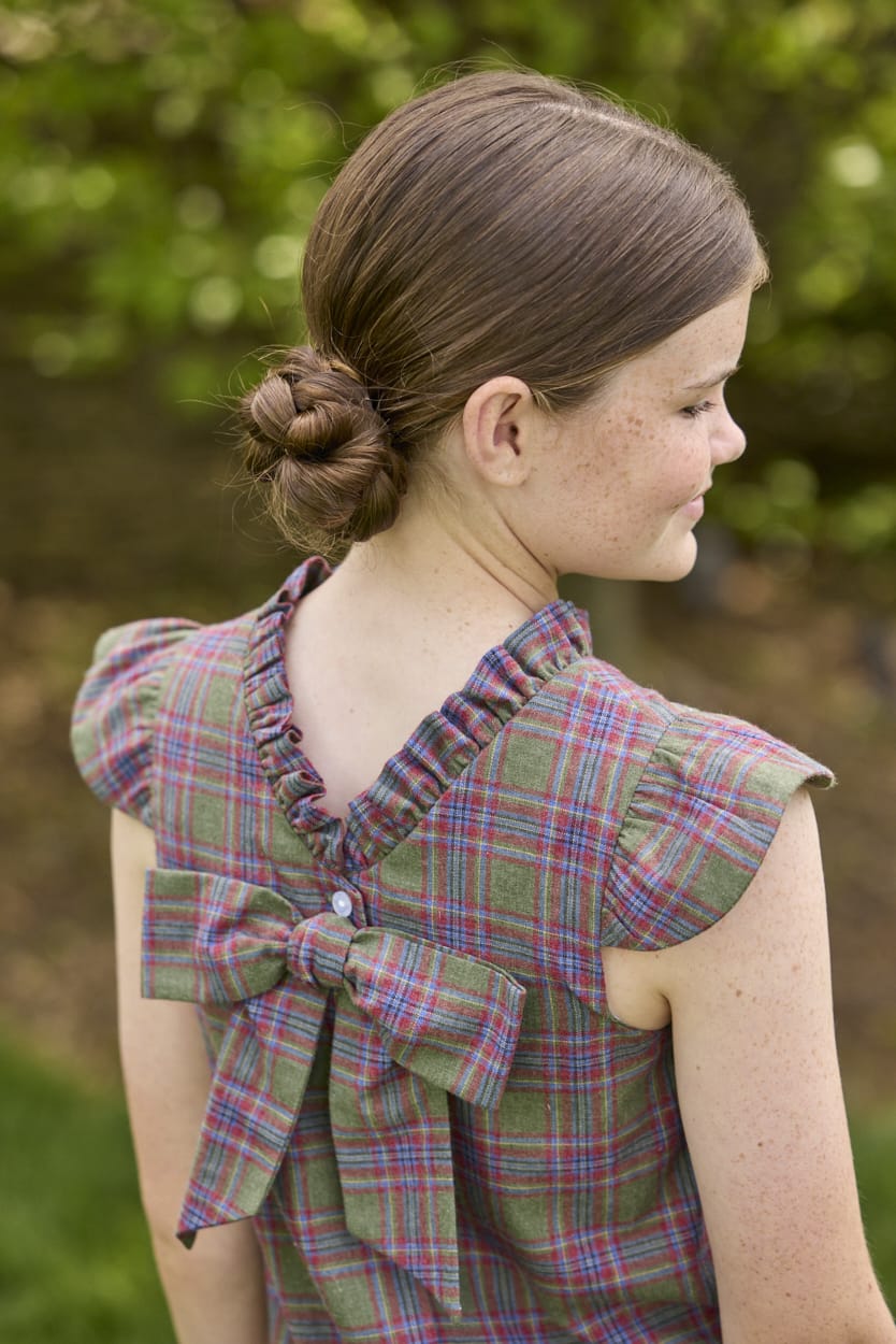Little English traditional children's clothing. Olive and maroon Thornhill Plaid column dress with capped sleeves, ruffled neckline, and fixed bow in back for older girls for the holidays