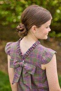 Little English traditional children's clothing. Olive and maroon Thornhill Plaid column dress with capped sleeves, ruffled neckline, and fixed bow in back for older girls for the holidays