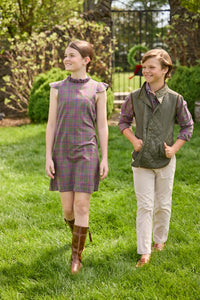 Little English traditional children's clothing. Olive and maroon Thornhill Plaid column dress with capped sleeves, ruffled neckline, and fixed bow in back for older girls for the holidays.  Boys Button Down Shirt in Thornhill Plaid with Classic Quilted Vest in Olive layered over top. Paired with Classic Pant in tan Stone Corduroy.