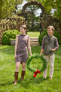Little English traditional children's clothing. Olive and maroon Thornhill Plaid column dress with capped sleeves, ruffled neckline, and fixed bow in back for older girls for the holidays.  Boys Button Down Shirt in Thornhill Plaid with Classic Quilted Vest in Olive layered over top. Paired with Classic Pant in tan Stone Corduroy.