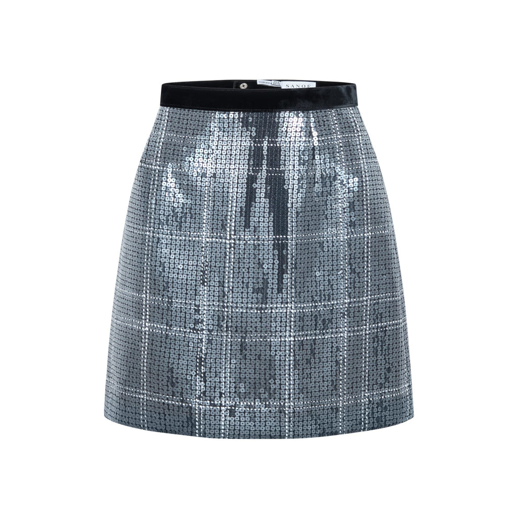 Front view of Ella Sequin silver mini skirt showcasing checkered sequin fabric and black waistband on white background
