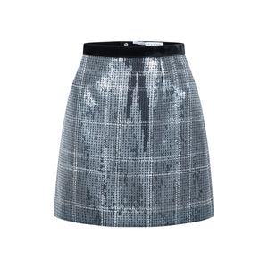 Front view of Ella Sequin silver mini skirt showcasing checkered sequin fabric and black waistband on white background