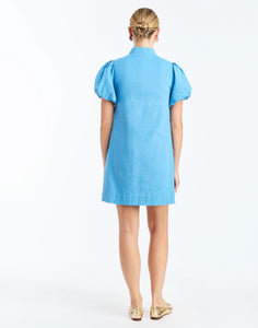 Back - Elliana Mini Dress in Cobalt Blue is an embroidered linen mini with V-neck, puff sleeves, and floral detailing.