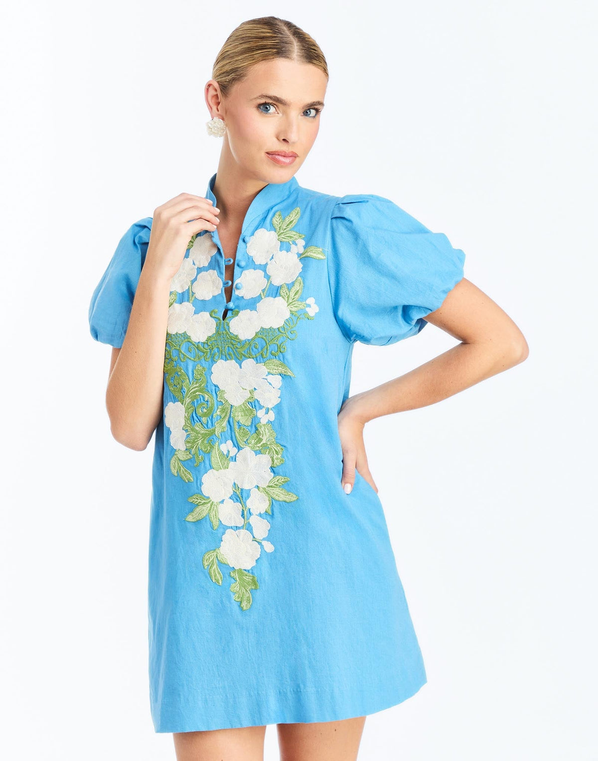Front - Elliana Mini Dress in Cobalt Blue is an embroidered linen mini with V-neck, puff sleeves, and floral detailing.