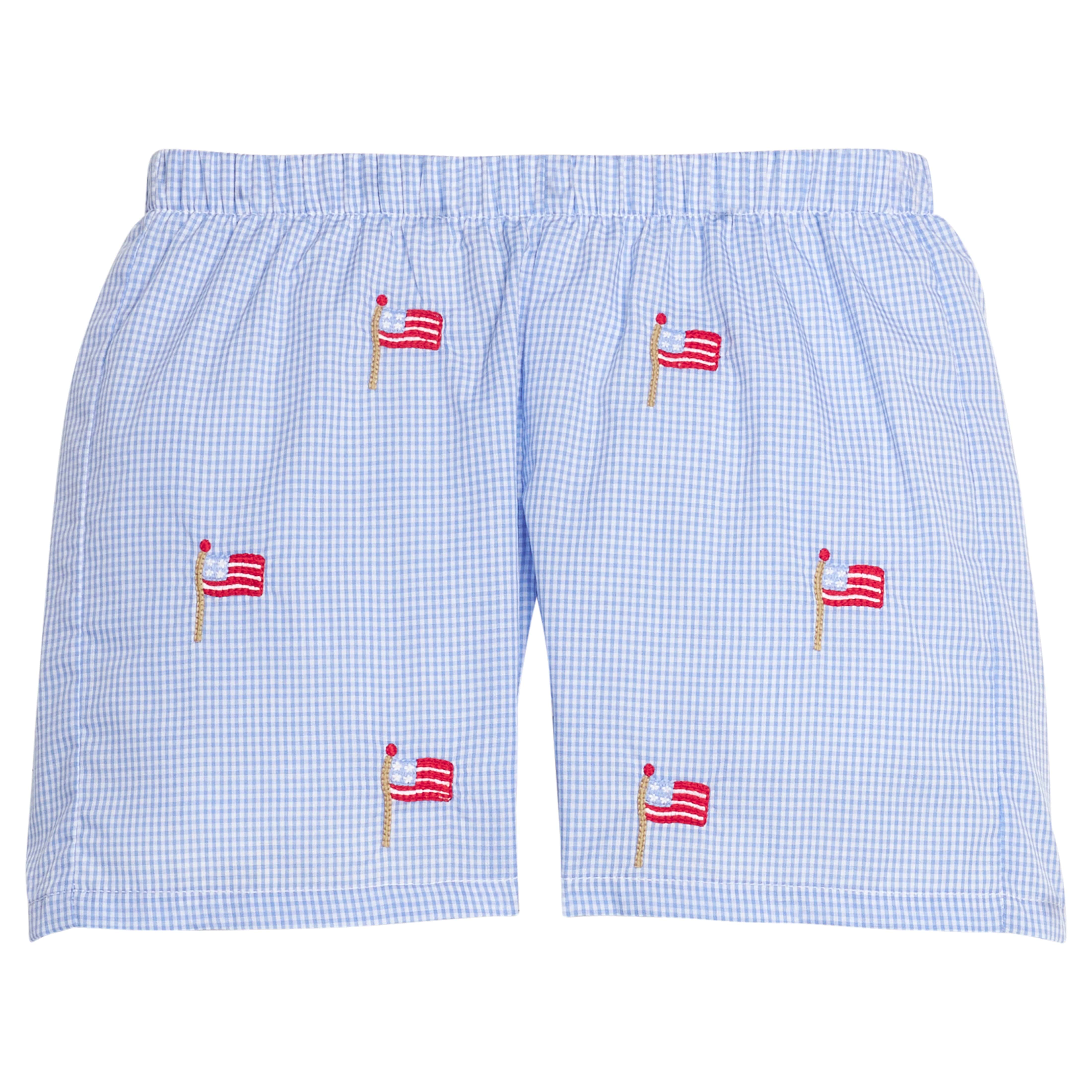 Little English traditional children's clothing.  Blue gingham shorts with all-over American flag embroidery for boys.  Boy's shorts for 4th of July.
