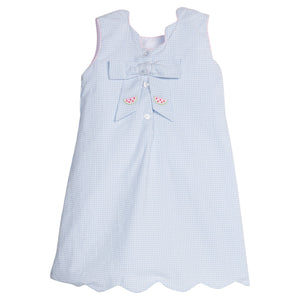 Little English traditional children's clothing.  Blue gingham dress for girls with scallop hem and bow back with all-over watermelon embroidery 