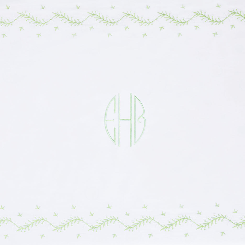 Little English classic nursery goods for baby, white crib sheet with simple light green embroidery along the edges for baby