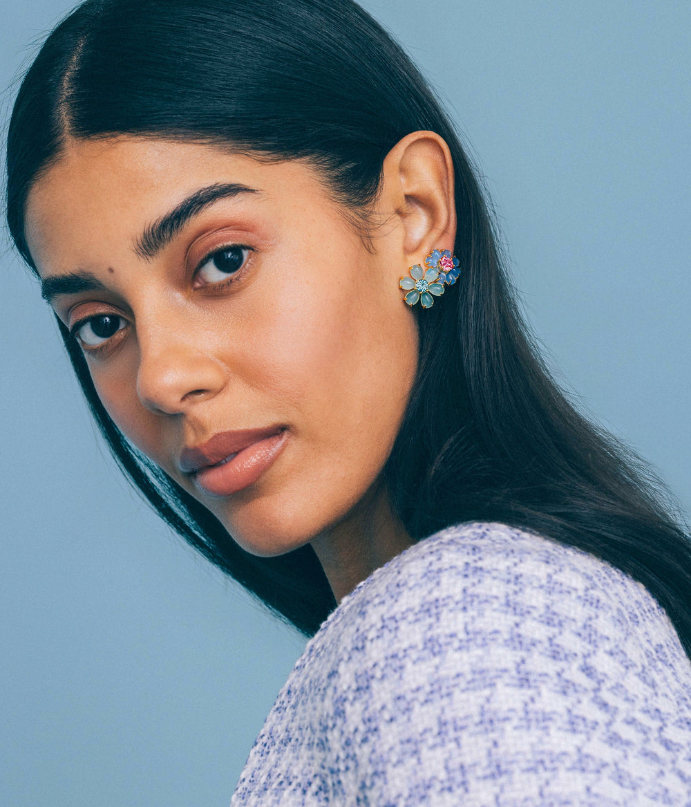 Close-up of model wearing Emeline Flower Studs in mint showing pastel cabochons and crystal centers