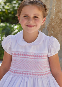 Little English traditional girl's clothing, classic smocked dress for toddler girls with peter pan collar and sash, little girl's flower girl dress with light pink smocking