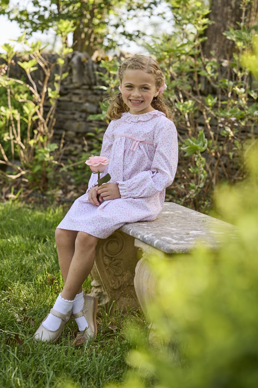Little English traditional children's clothing. Long sleeve pink and green Windemere floral dress with ruffled collar and fixed bow detail for little girls
