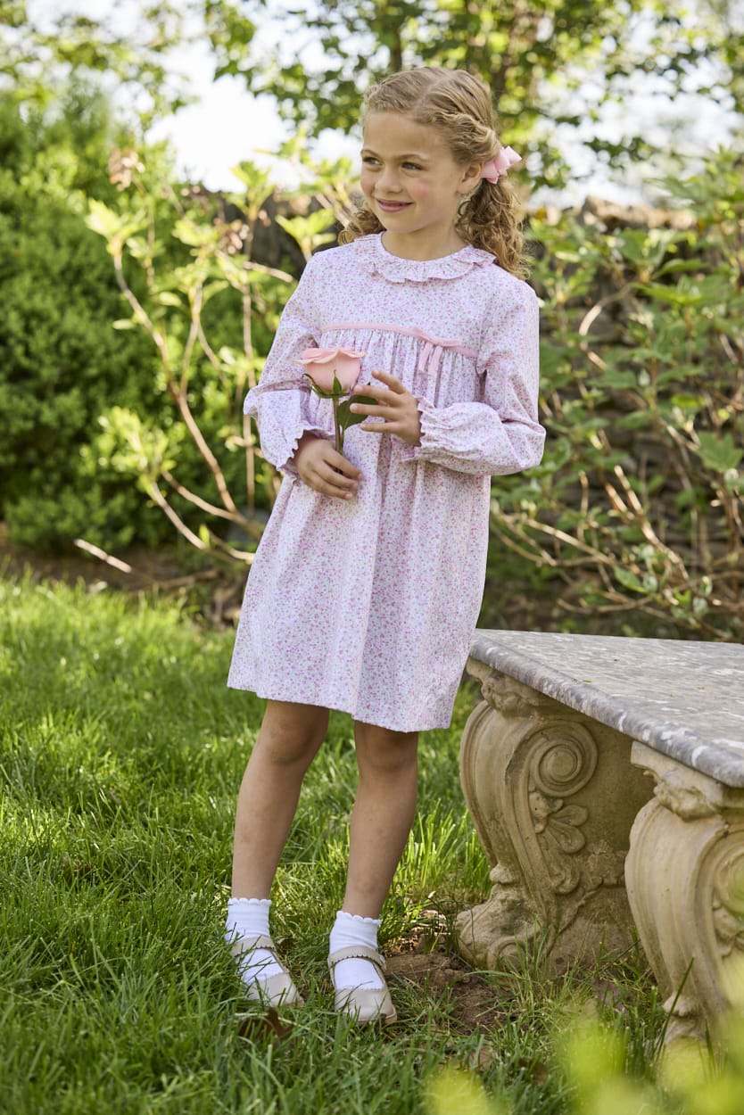 Little English traditional children's clothing. Long sleeve pink and green Windemere floral dress with ruffled collar and fixed bow detail for little girls