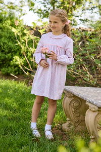Little English traditional children's clothing. Long sleeve pink and green Windemere floral dress with ruffled collar and fixed bow detail for little girls
