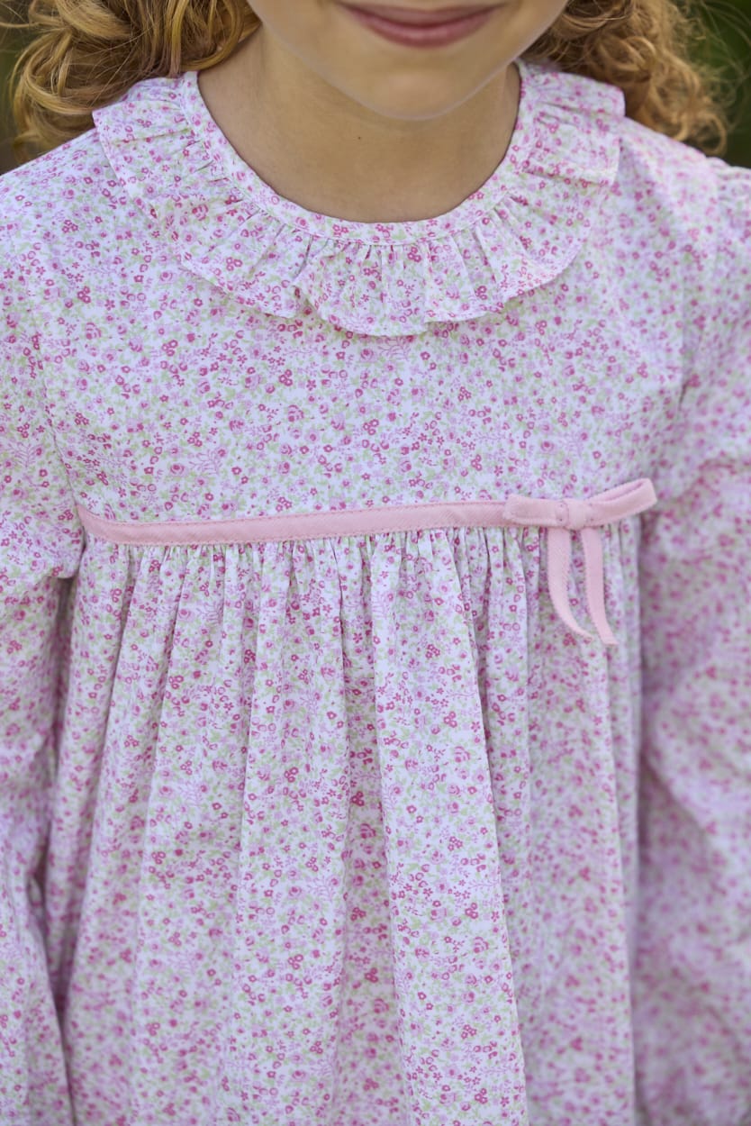 Little English traditional children's clothing. Long sleeve pink and green Windemere floral dress with ruffled collar and fixed bow detail for little girls