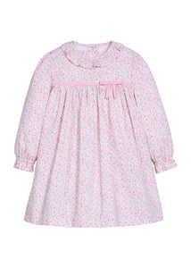 Little English traditional children's clothing.  Long sleeve dress in pink and green floral with ruffle collar and fixed pink bow across the chest for little girls