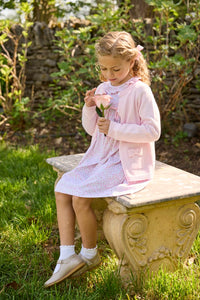 Little English traditional children's clothing. Long sleeve pink and green Windemere floral dress with ruffled collar and fixed bow detail for little girls.  Layered with light pink bow pocket cardigan.