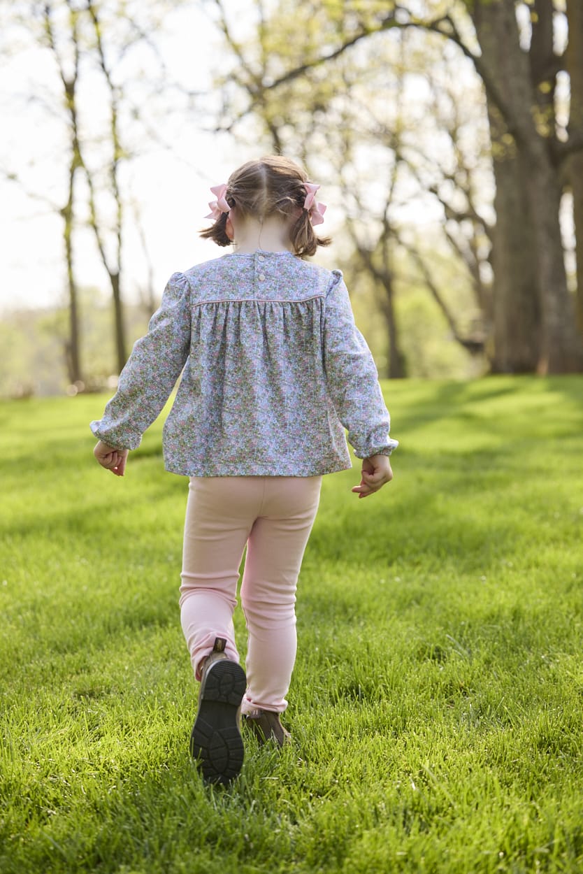 Little English traditional children's clothing. Long sleeve pink, aqua, and green Fondren Floral cotton knit top with pink piping detail for little girls. Paired with classic light pink leggings.